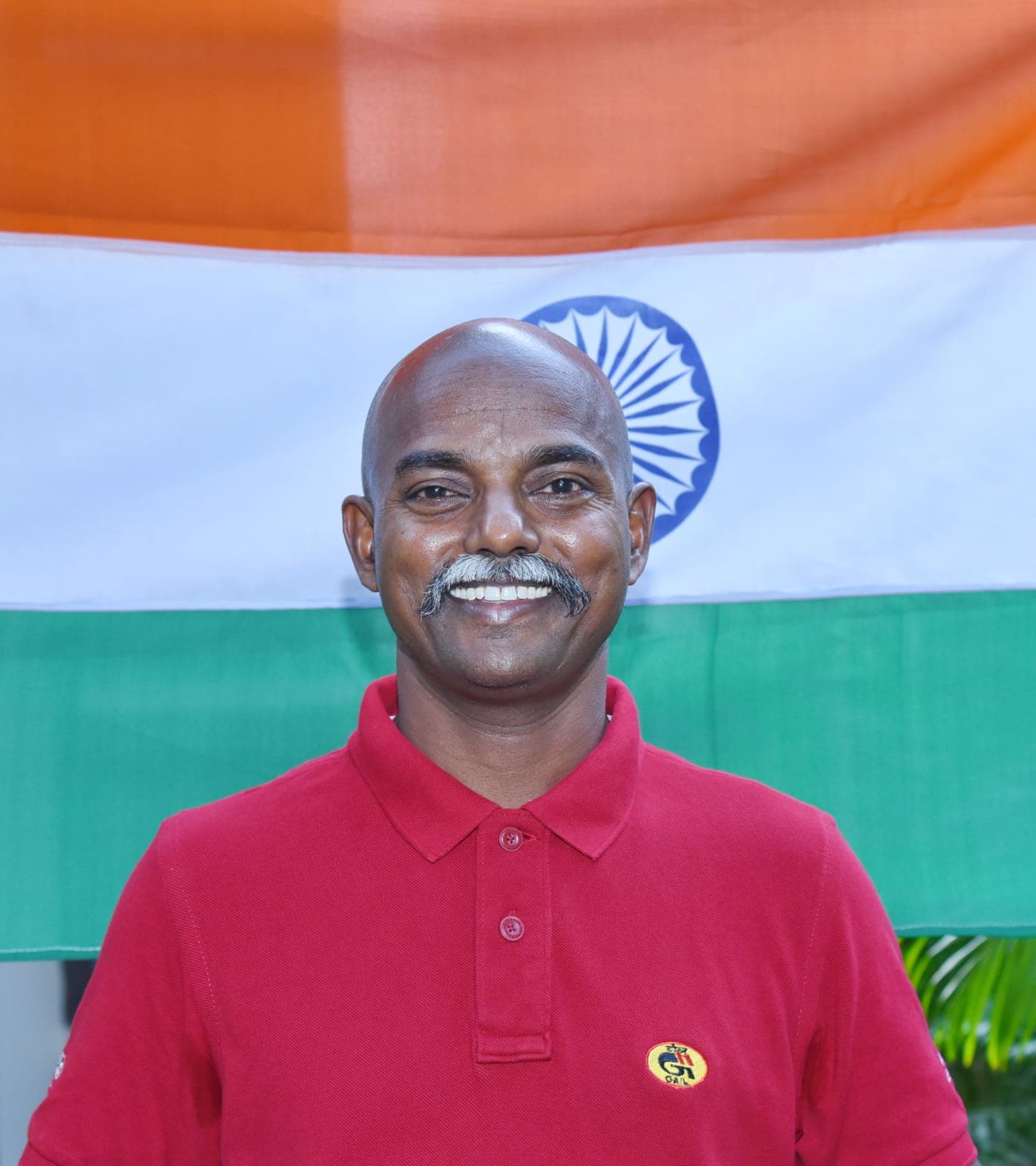 Portrait of Bobba Ravinder Reddy with the Indian flag backdrop