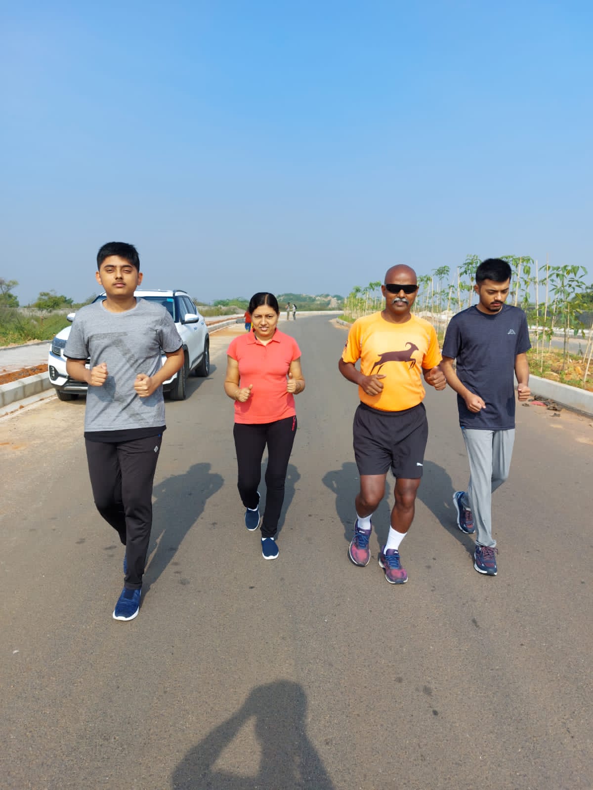 Bobba Ravinder Reddy jogging with family on an open road