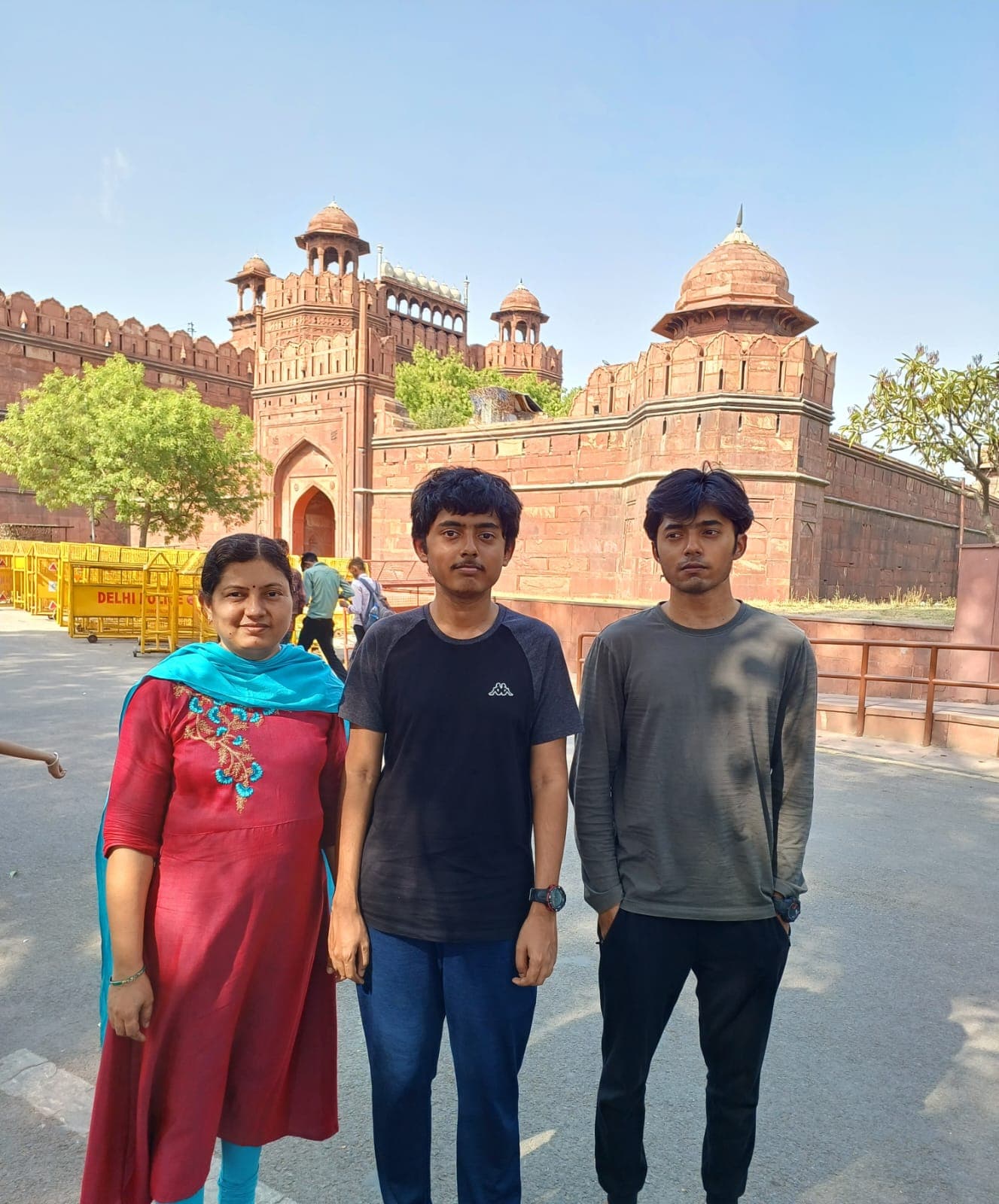 Two sons and their mother in front of the Red Fort, Delhi